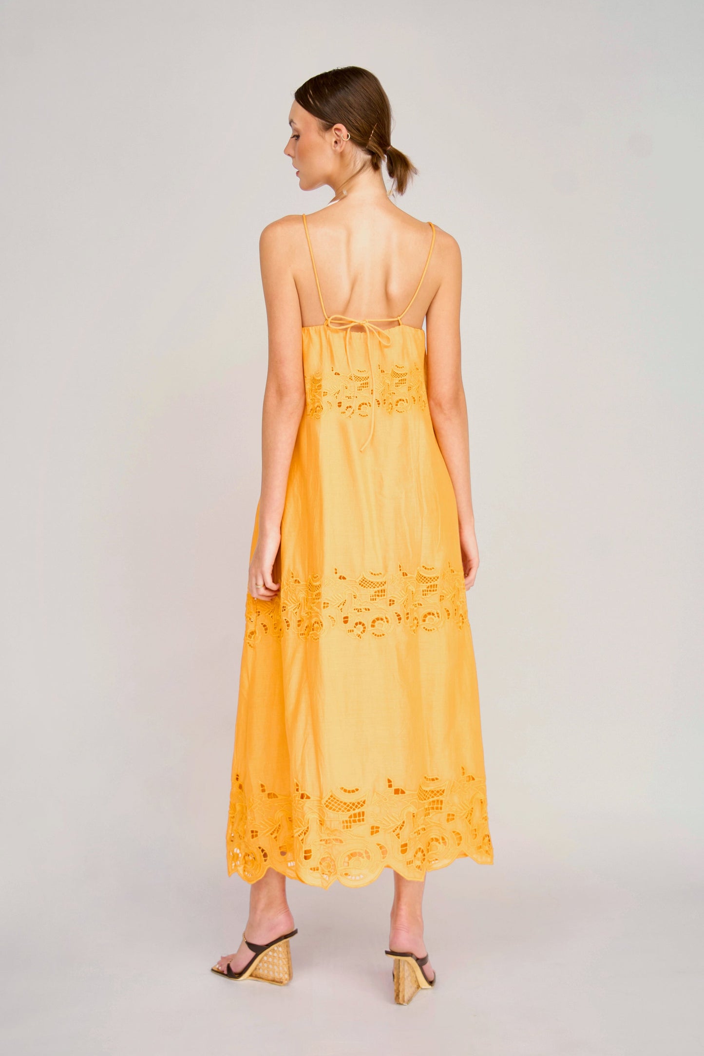 Yellow cotton maxi dress on a hanger in store