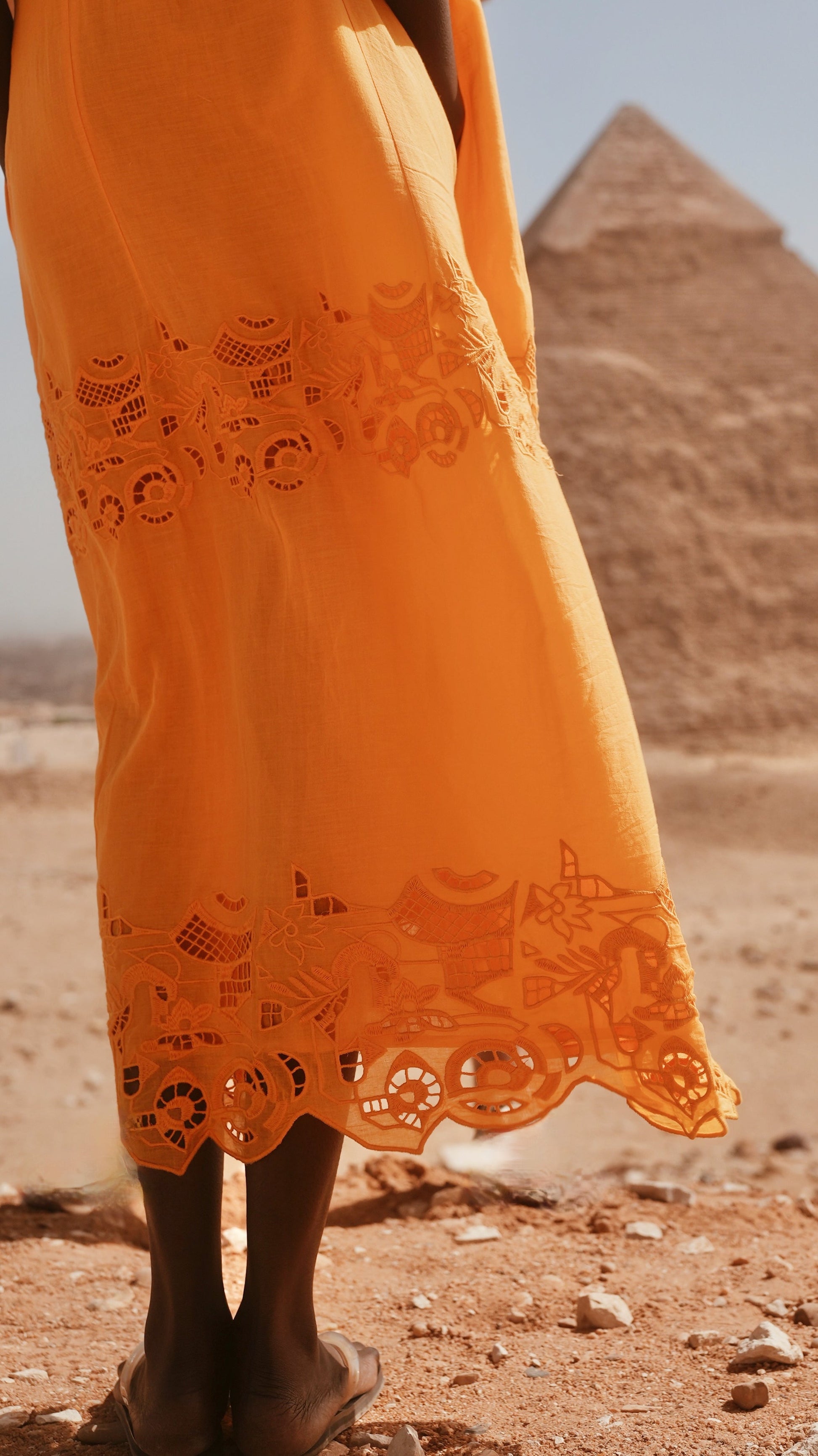Yellow cotton maxi dress on a hanger in store