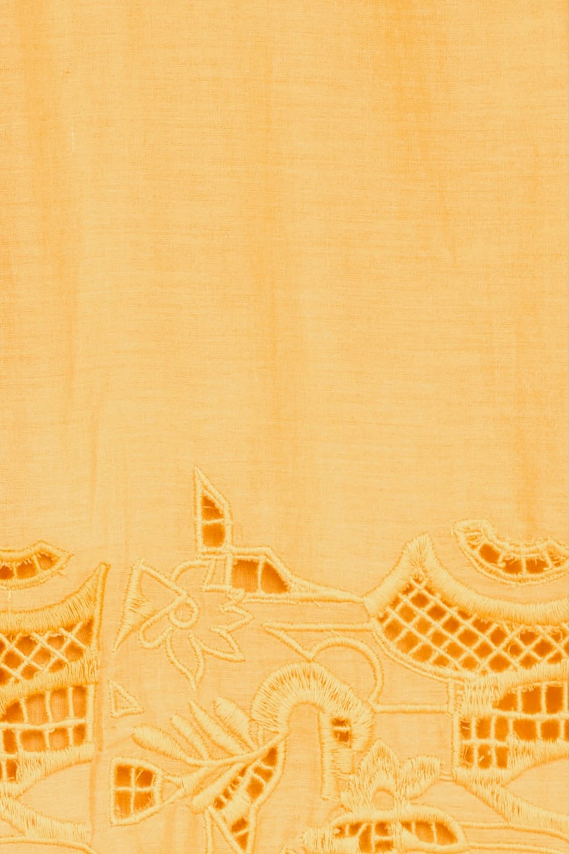 Yellow cotton maxi dress on a hanger in store