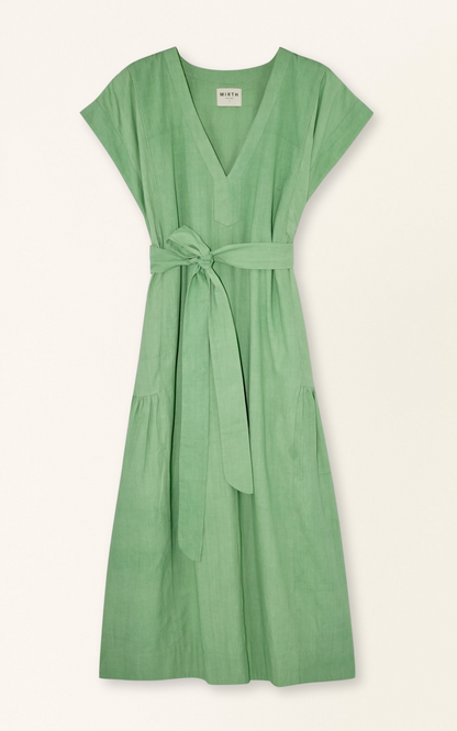 Green cotton midi dress on a hanger in store