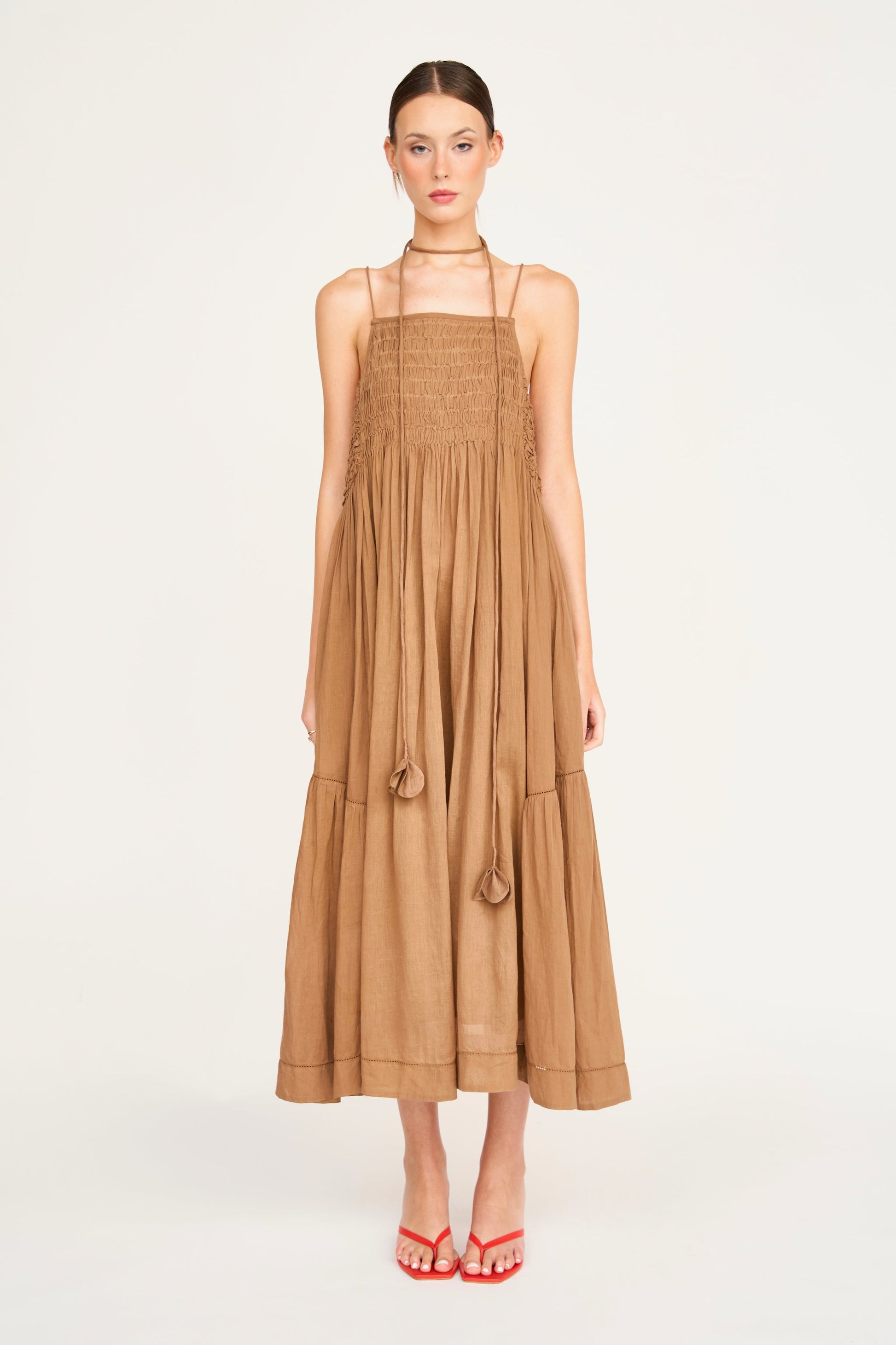Brown cotton maxi dress on a hanger in store