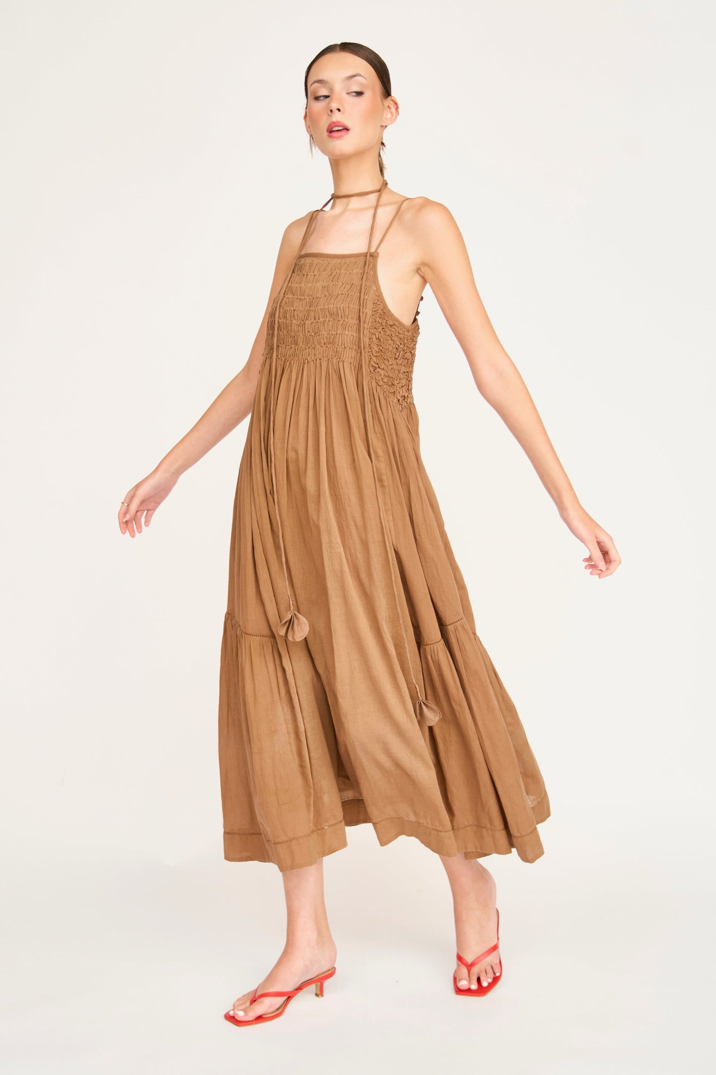 Brown cotton maxi dress on a hanger in store