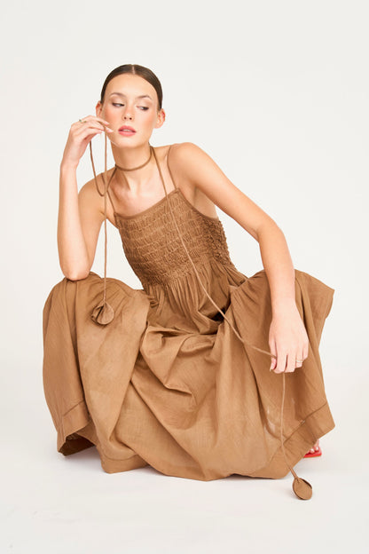 Brown cotton maxi dress on a hanger in store