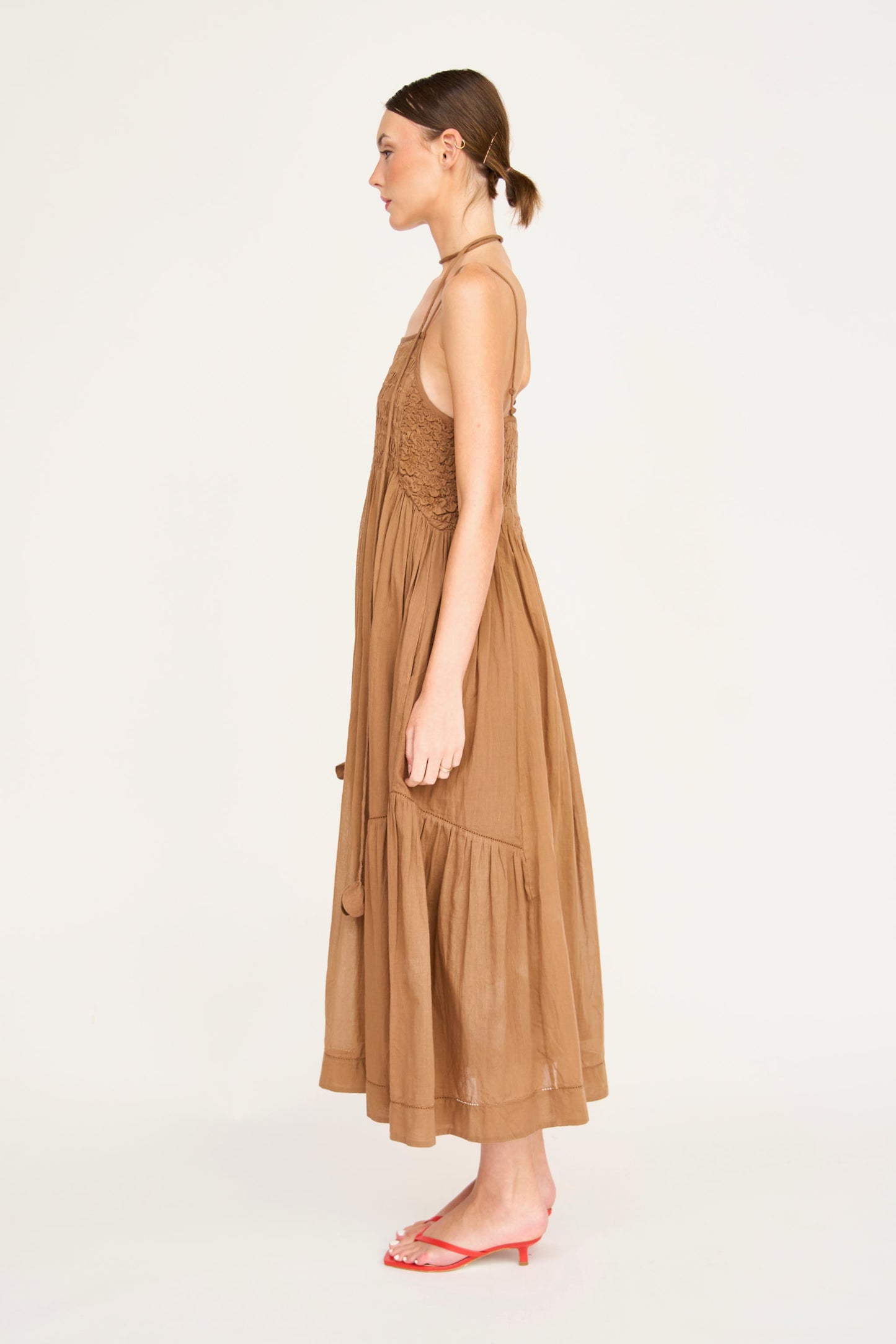 Brown cotton maxi dress on a hanger in store