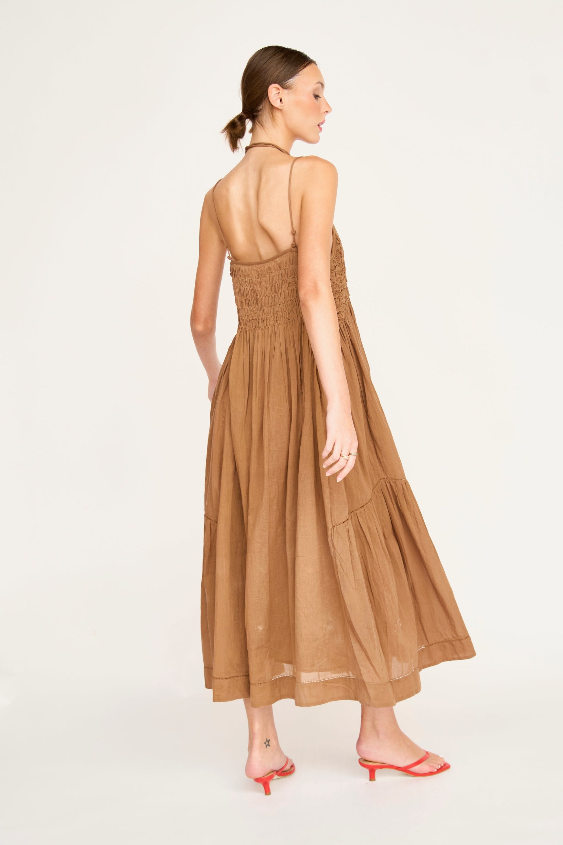 Brown cotton maxi dress on a hanger in store