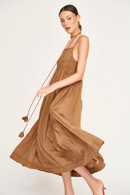 Brown cotton maxi dress on a hanger in store