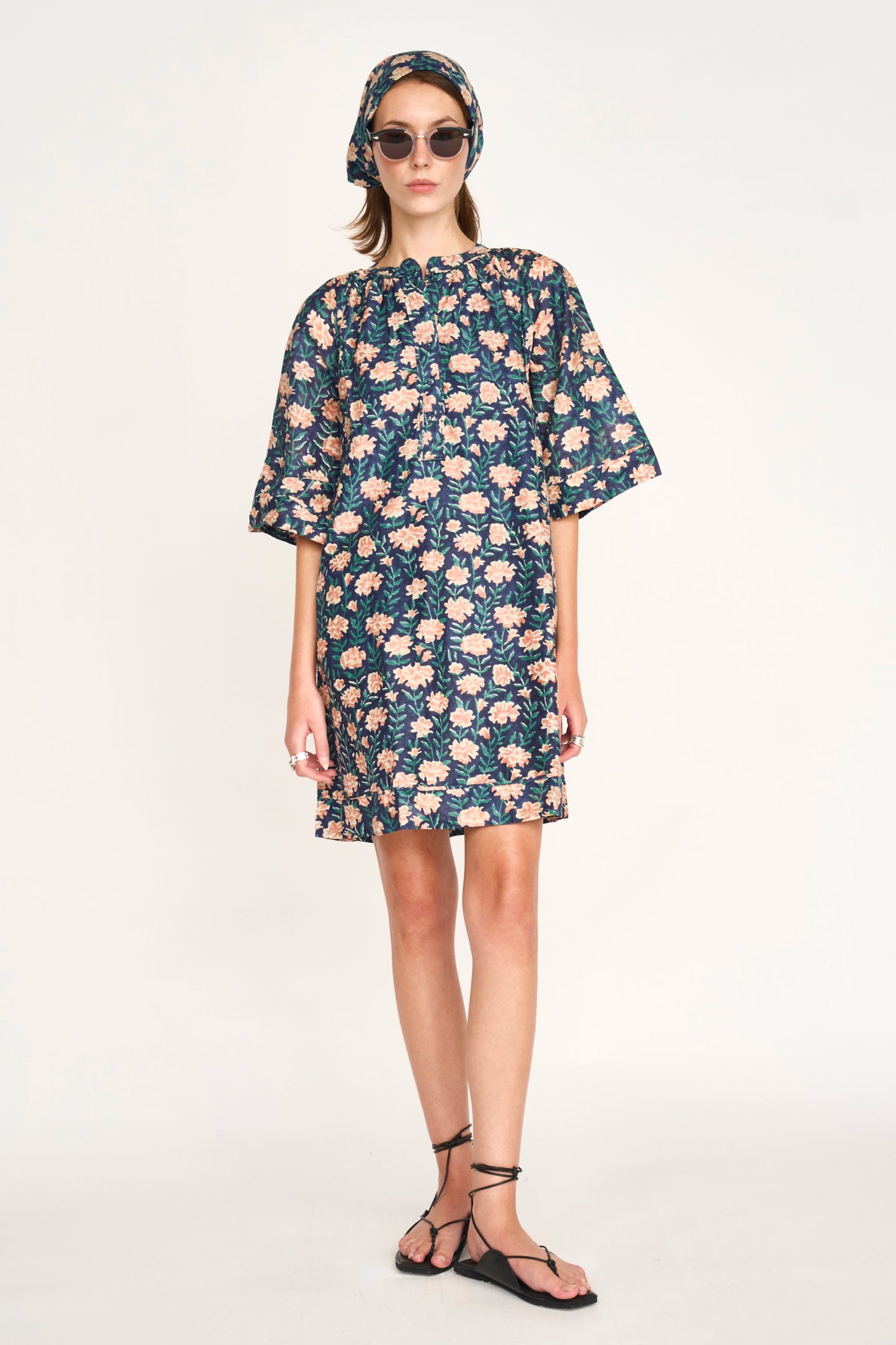 Pink cotton short dress on a hanger in store