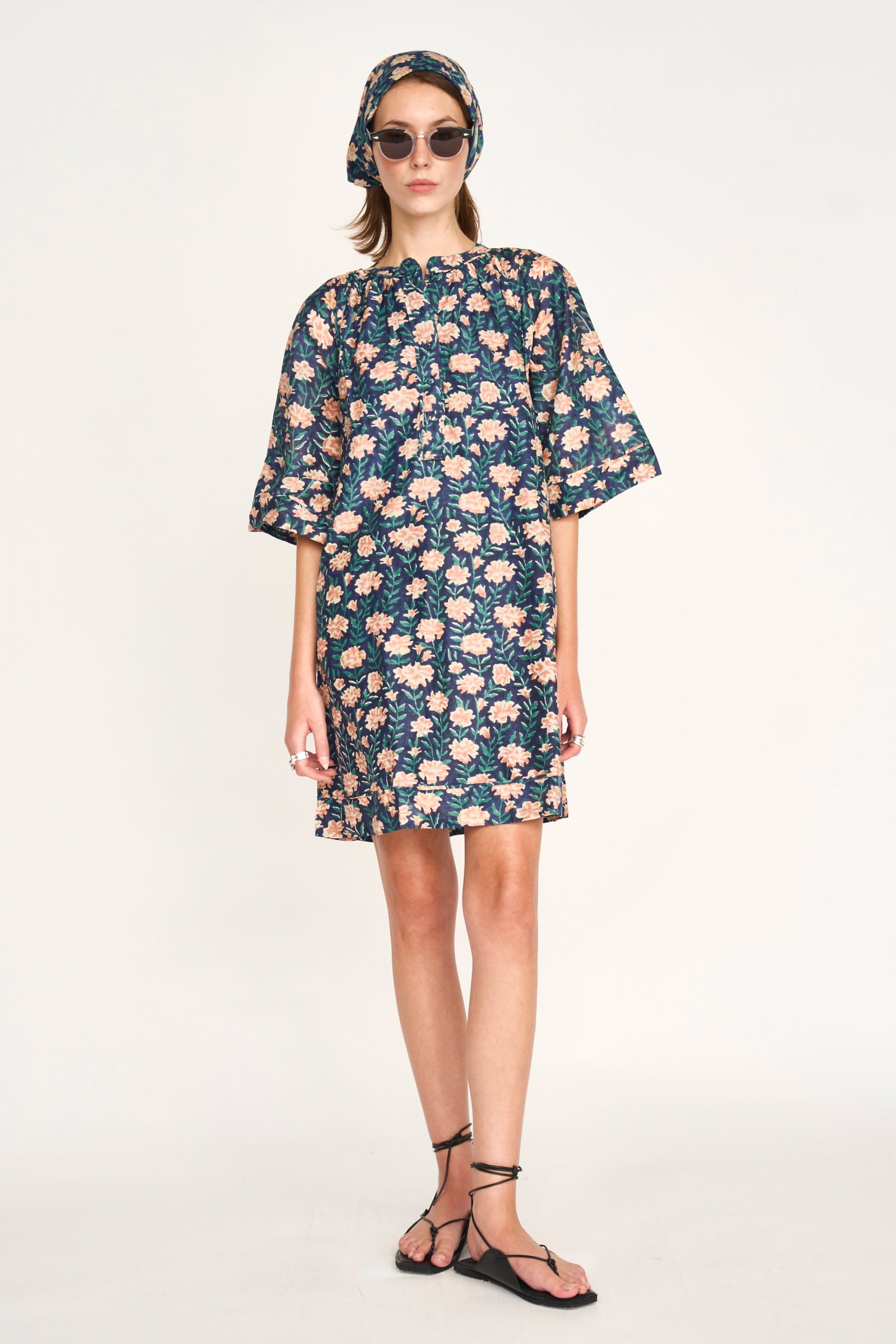 Pink cotton short dress on a hanger in store