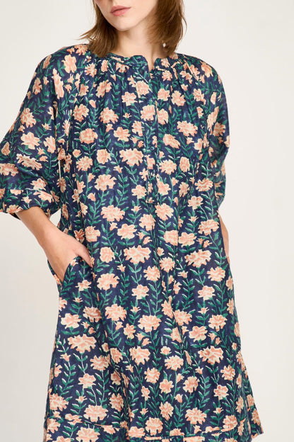 Pink cotton short dress on a hanger in store