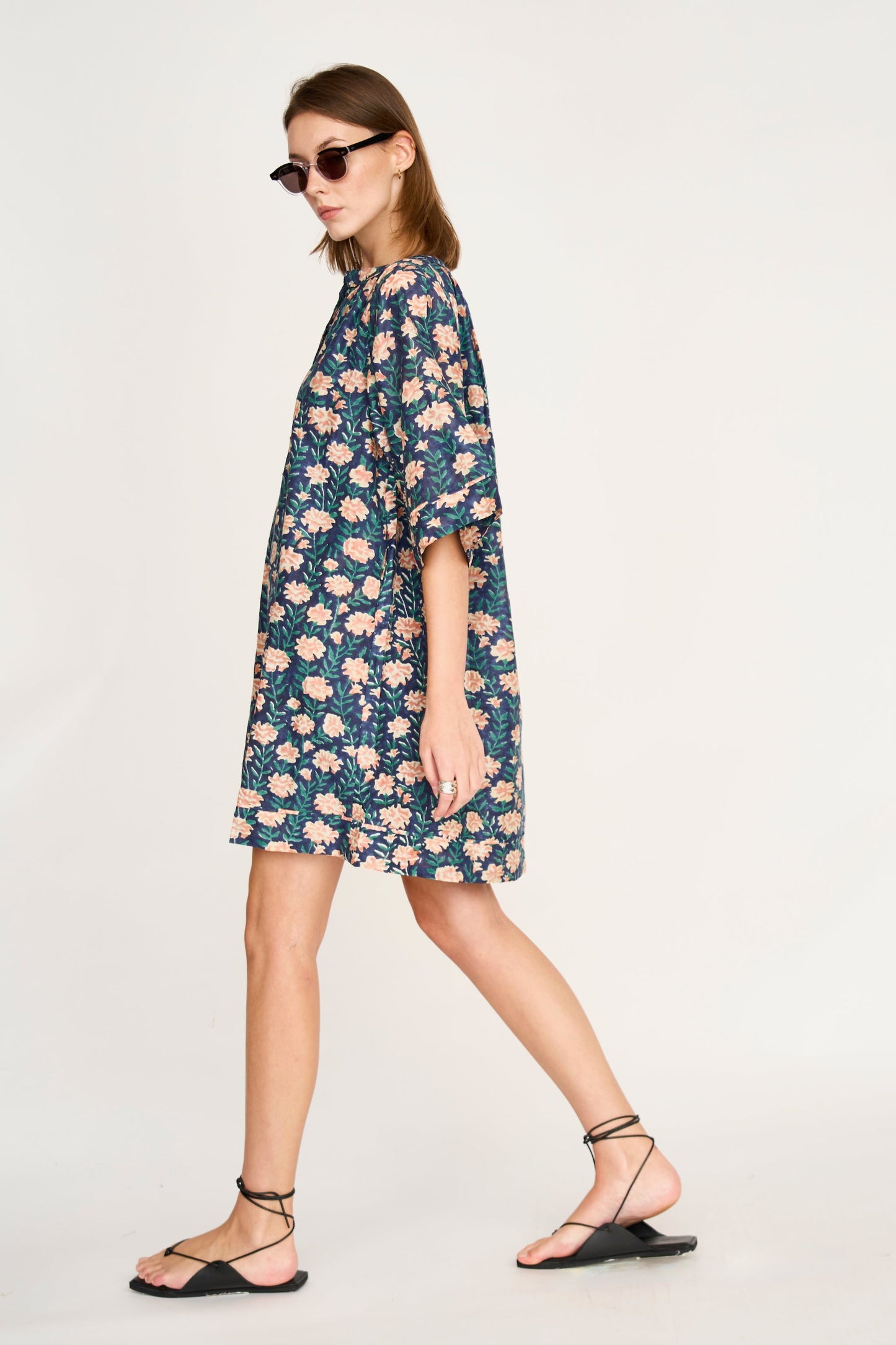 Pink cotton short dress on a hanger in store