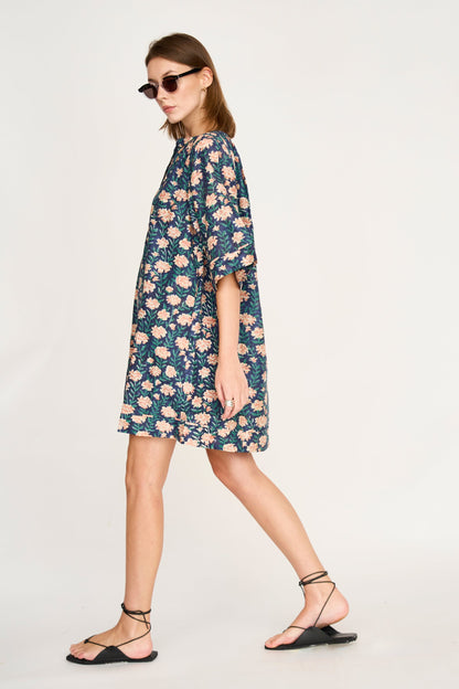 Pink cotton short dress on a hanger in store