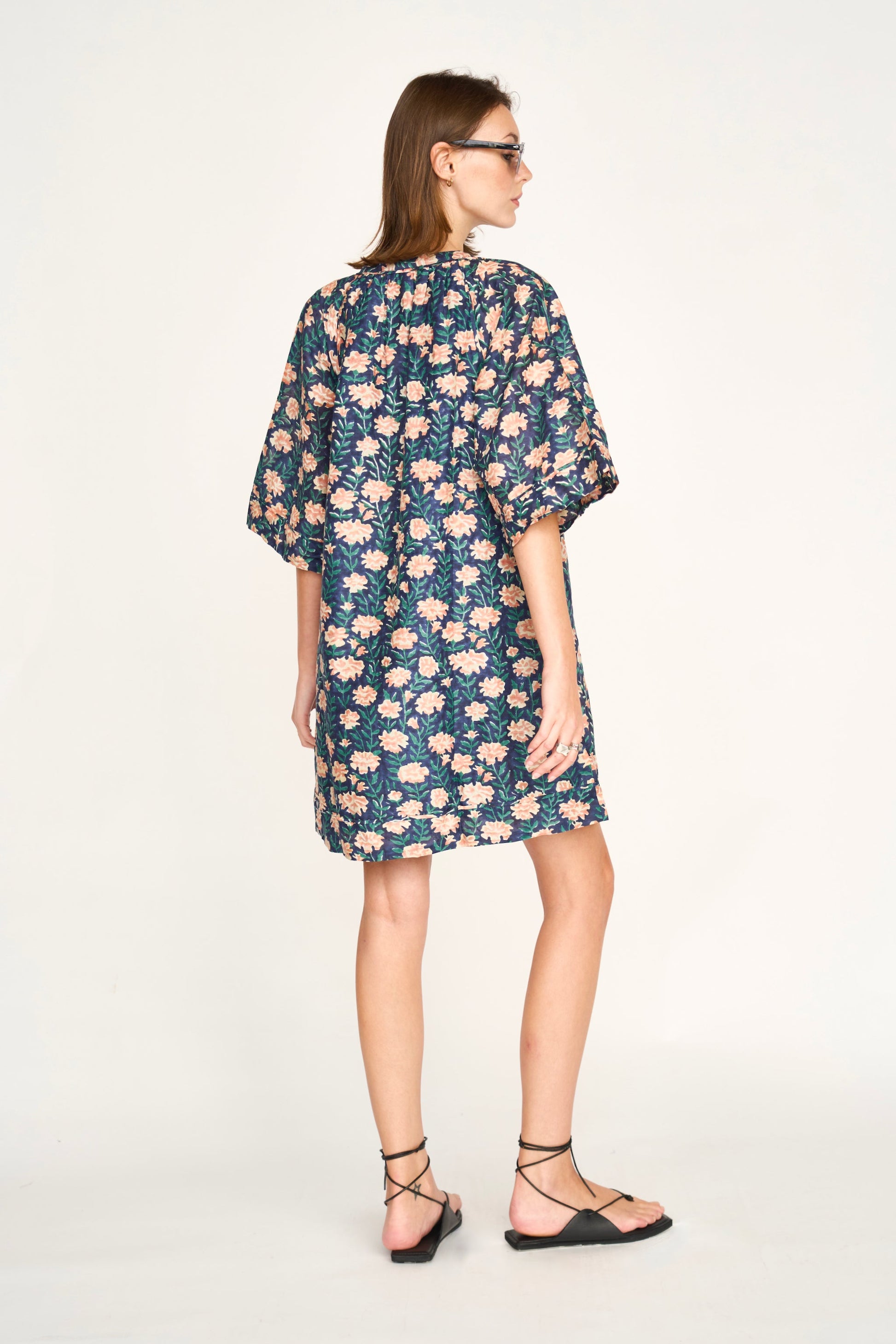 Pink cotton short dress on a hanger in store