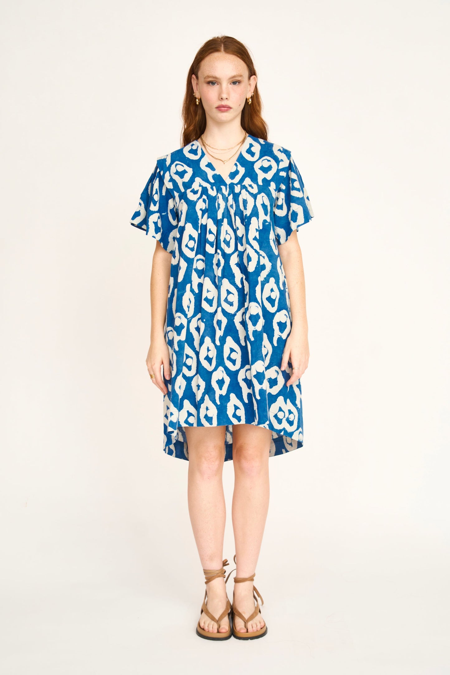 Indigo cotton short dress on a hanger in store