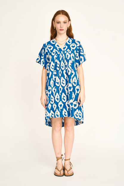 Indigo cotton short dress on a hanger in store