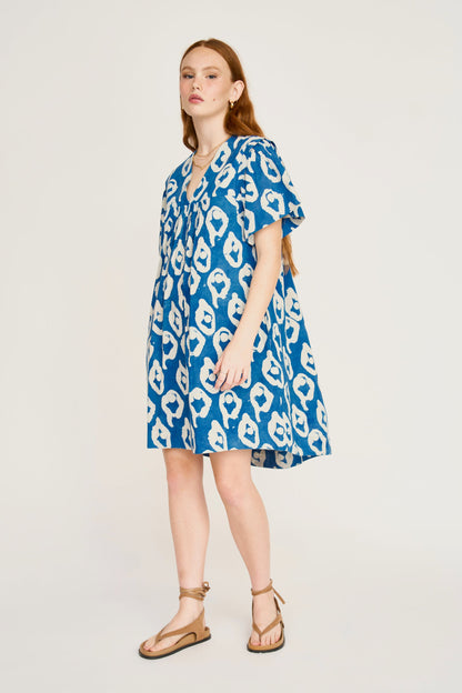 Indigo cotton short dress on a hanger in store