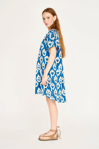 Indigo cotton short dress on a hanger in store