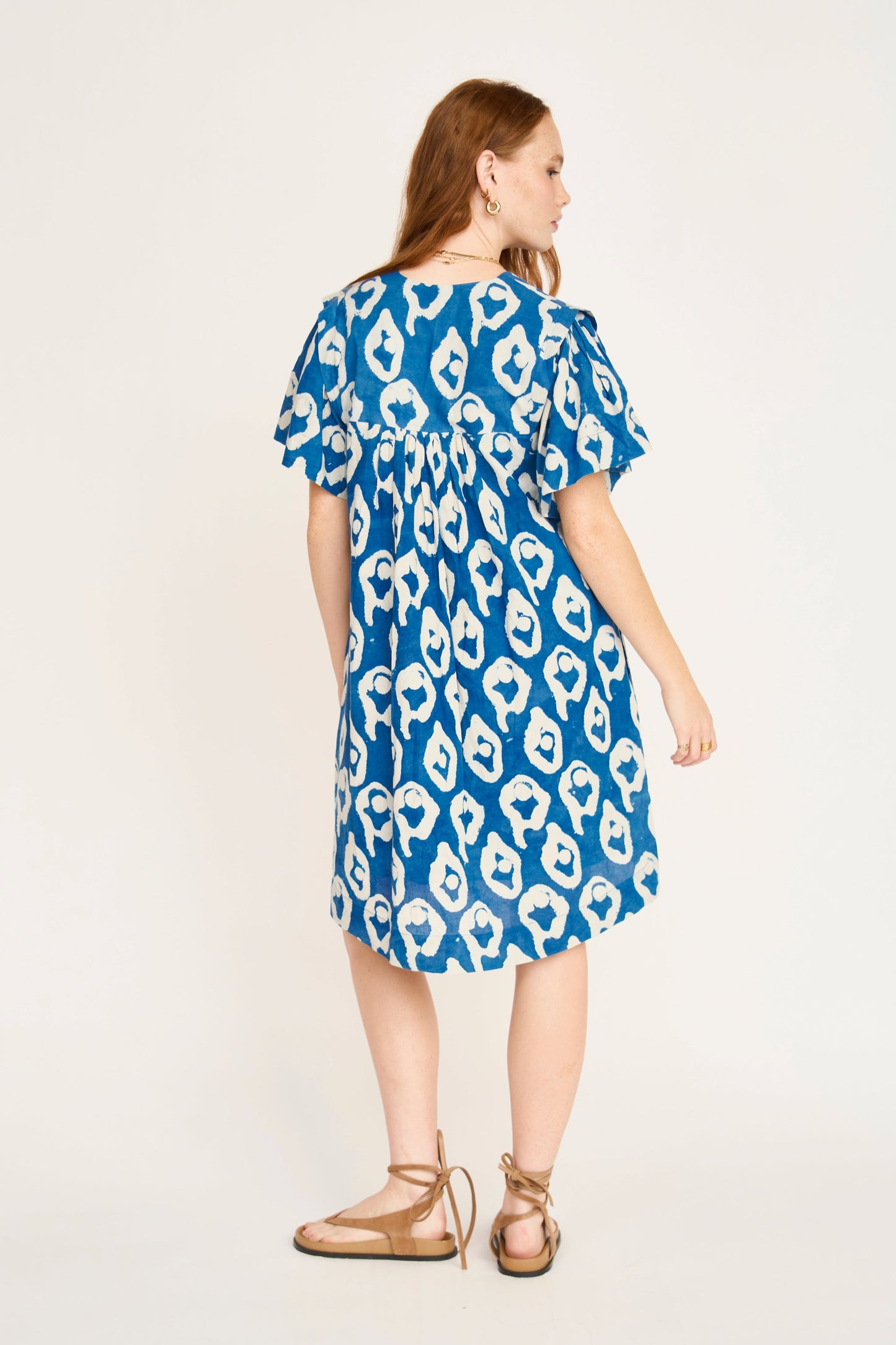 Indigo cotton short dress on a hanger in store