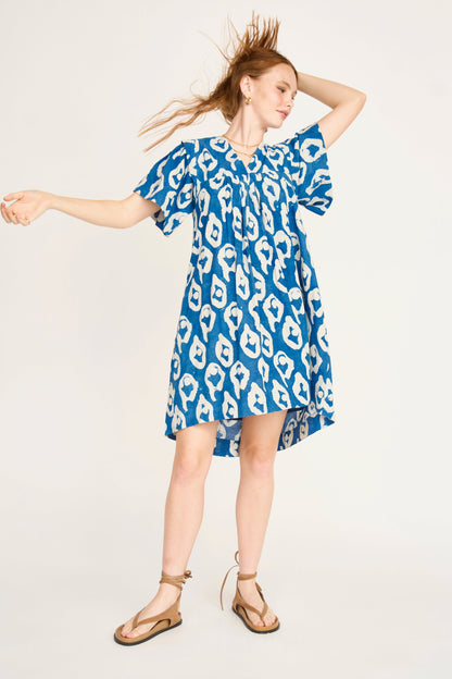 Indigo cotton short dress on a hanger in store