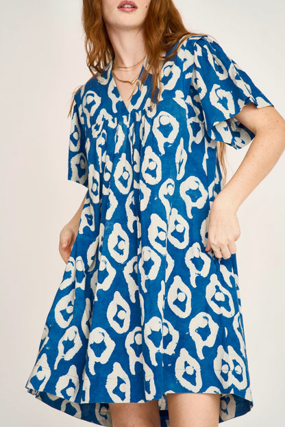 Indigo cotton short dress on a hanger in store