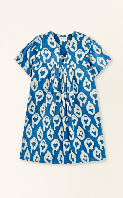 Indigo cotton short dress on a hanger in store
