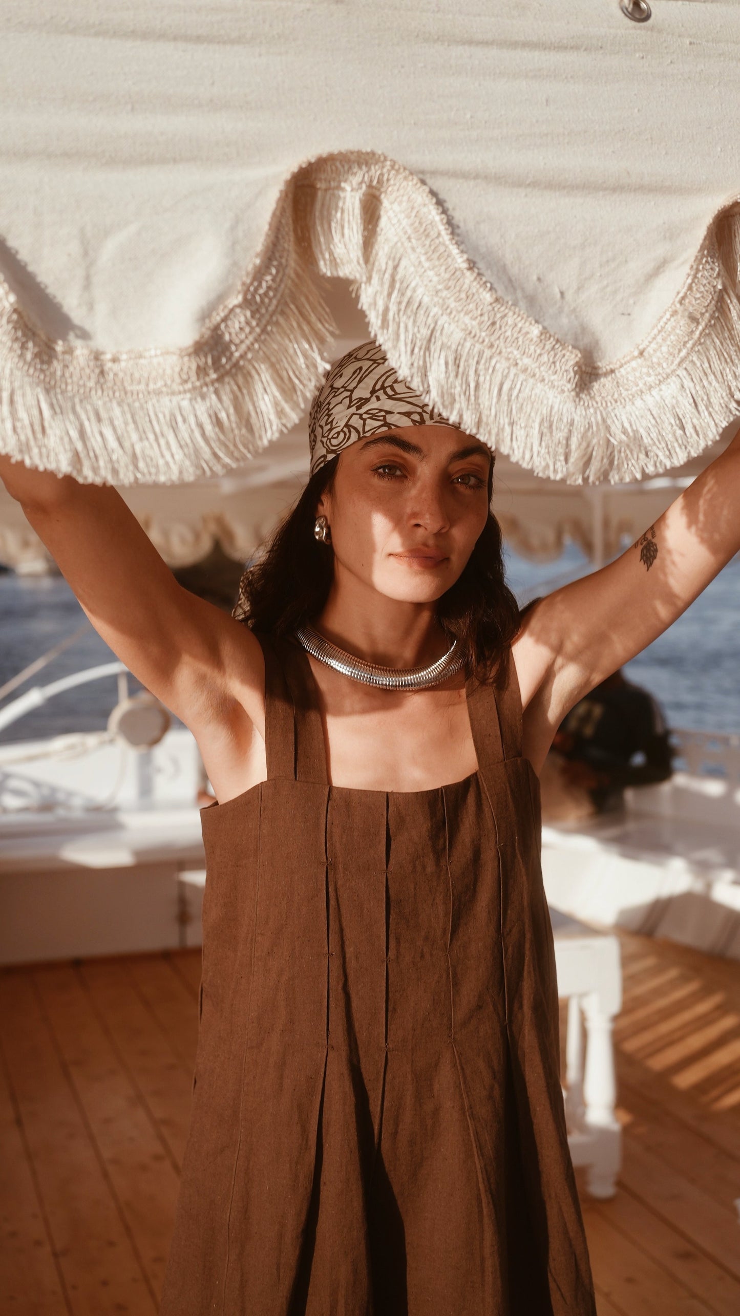 Brown linen short dress on a hanger in store