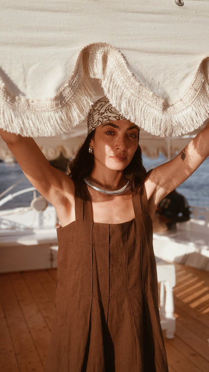 Brown linen short dress on a hanger in store