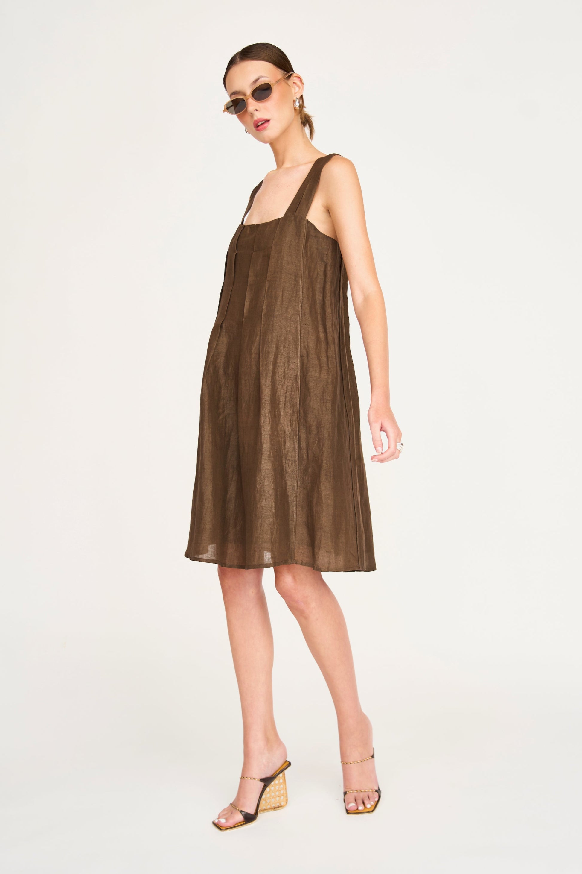 Brown linen short dress on a hanger in store