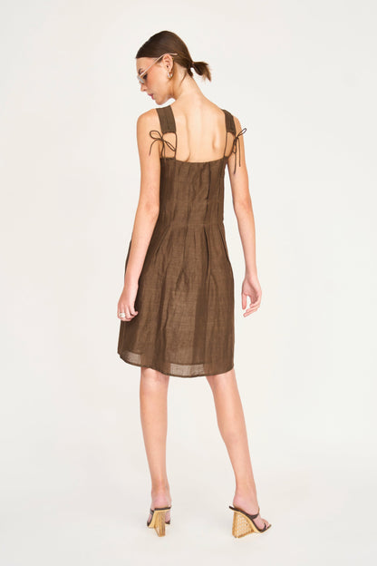 Brown linen short dress on a hanger in store