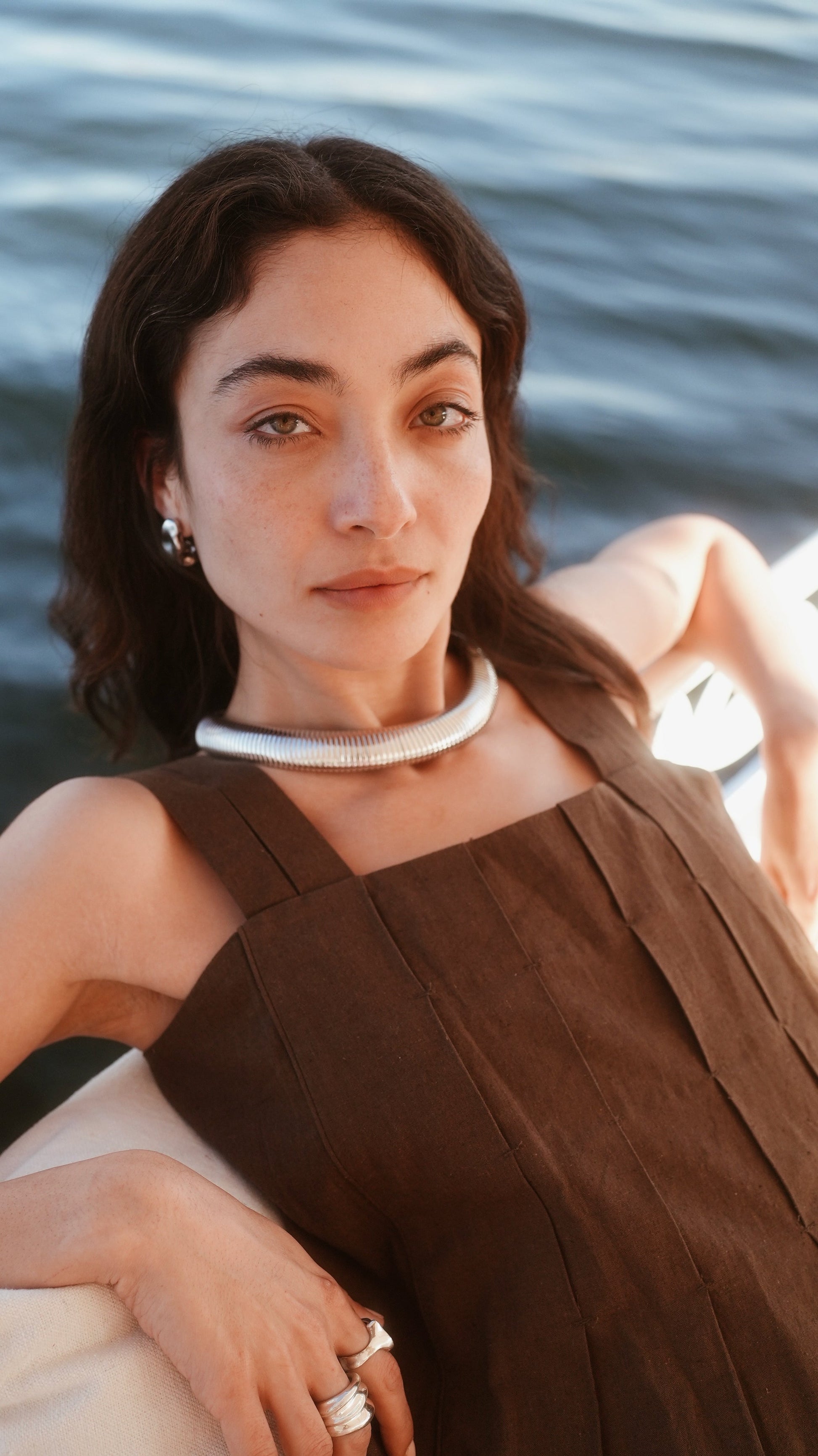 Brown linen short dress on a hanger in store