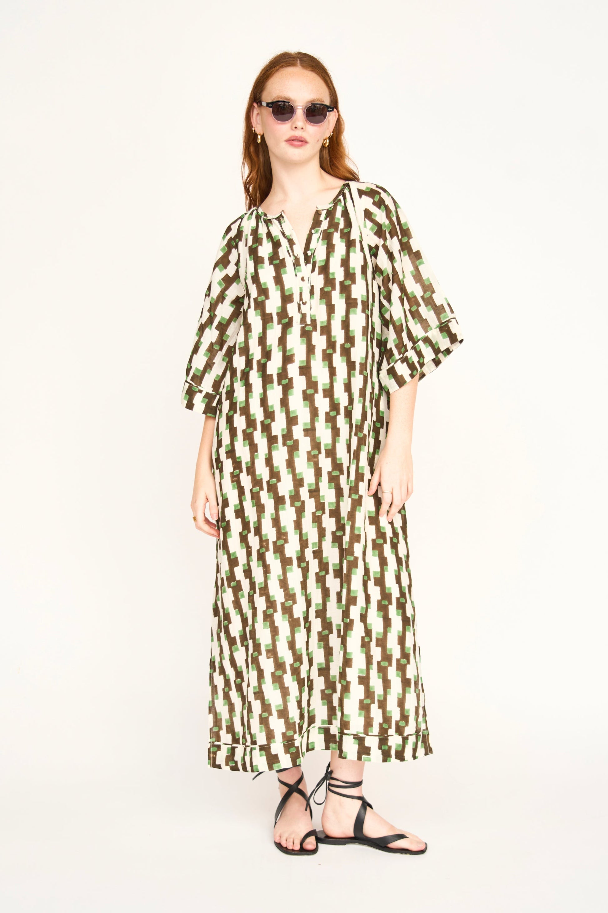 Brown cotton maxi dress on a hanger in store