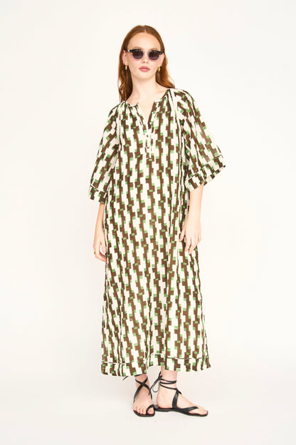 Brown cotton maxi dress on a hanger in store