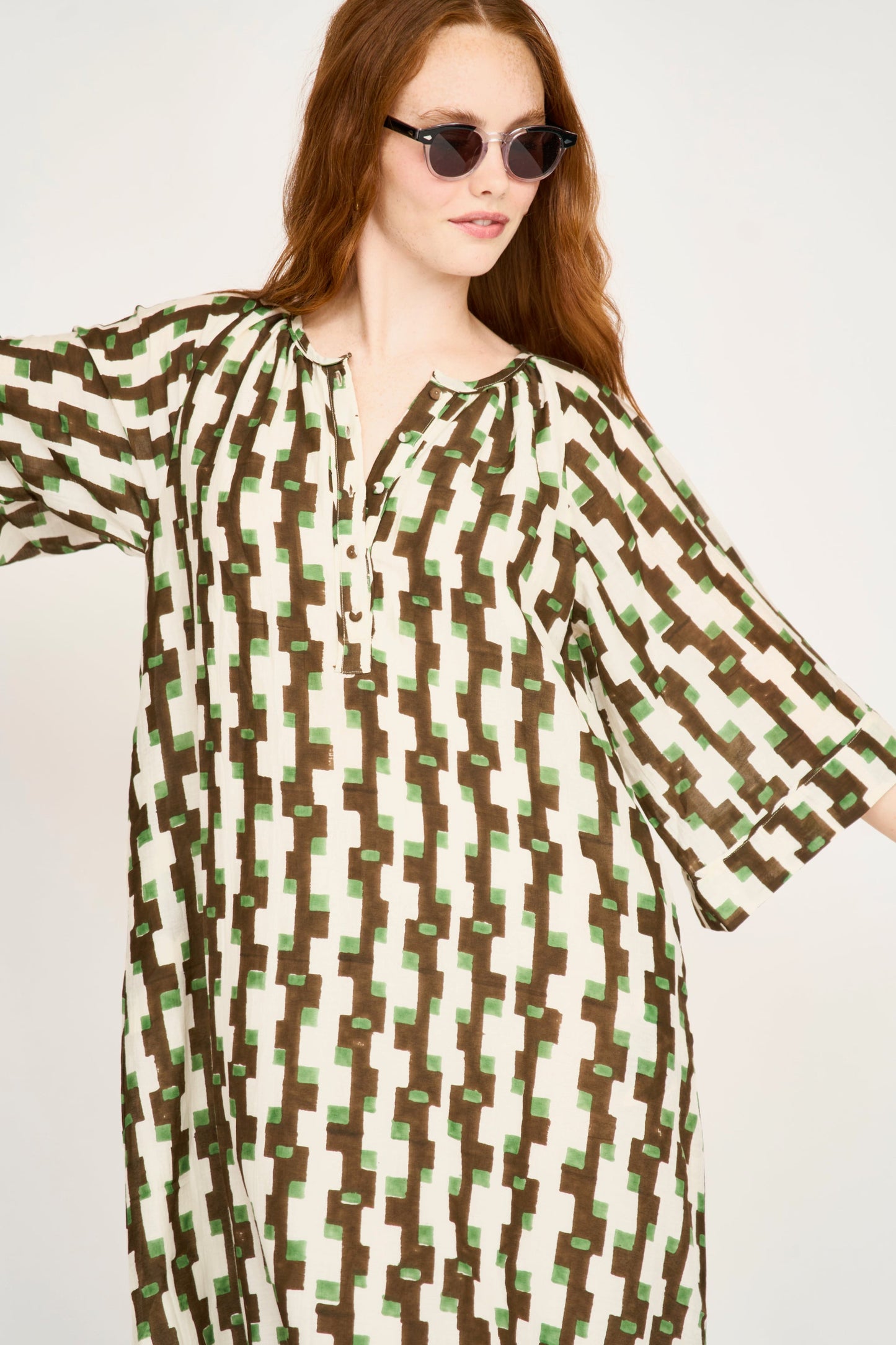 Brown cotton maxi dress on a hanger in store