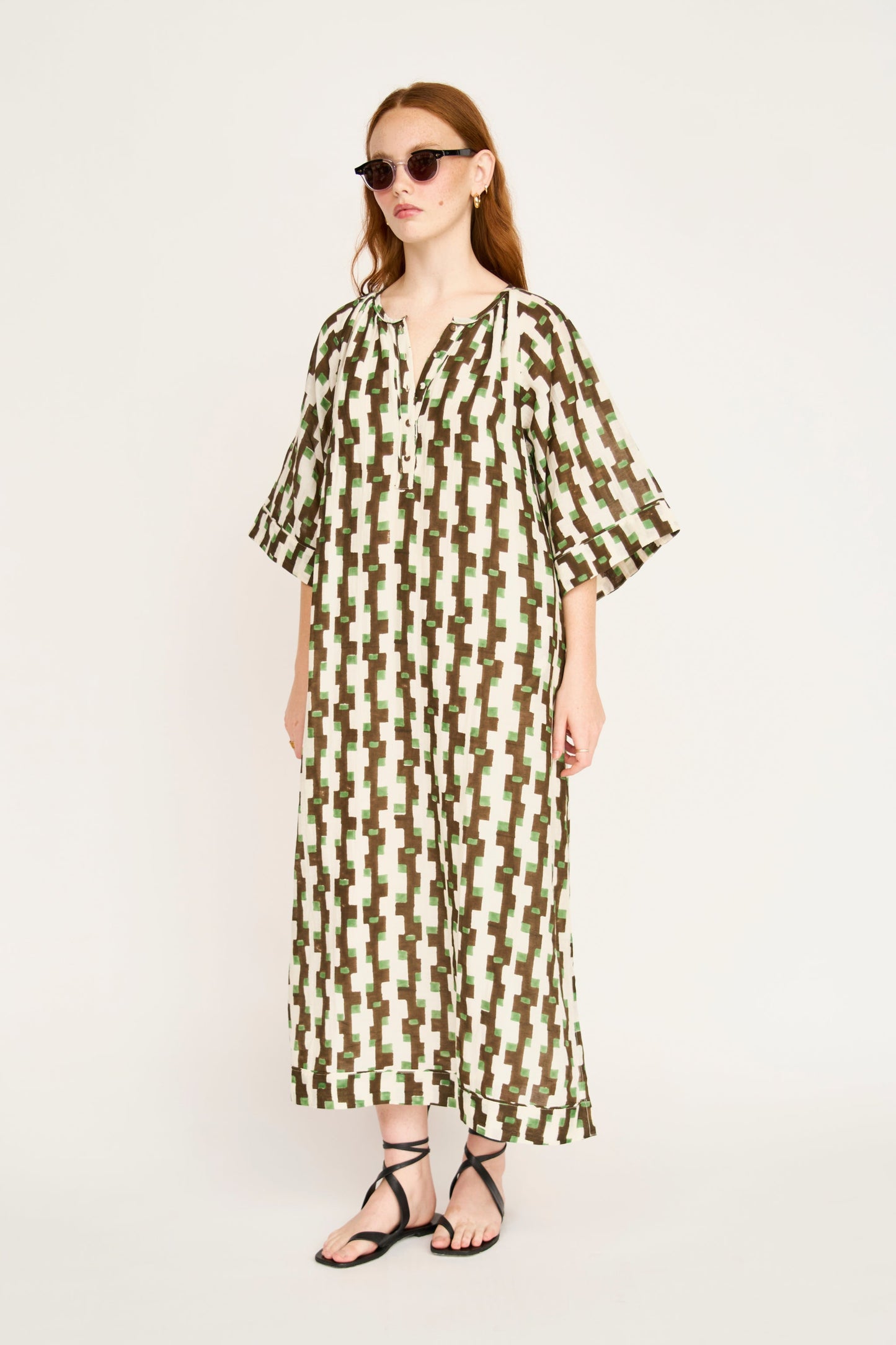 Brown cotton maxi dress on a hanger in store