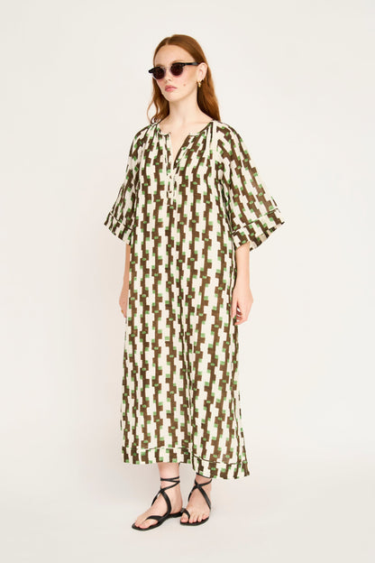 Brown cotton maxi dress on a hanger in store