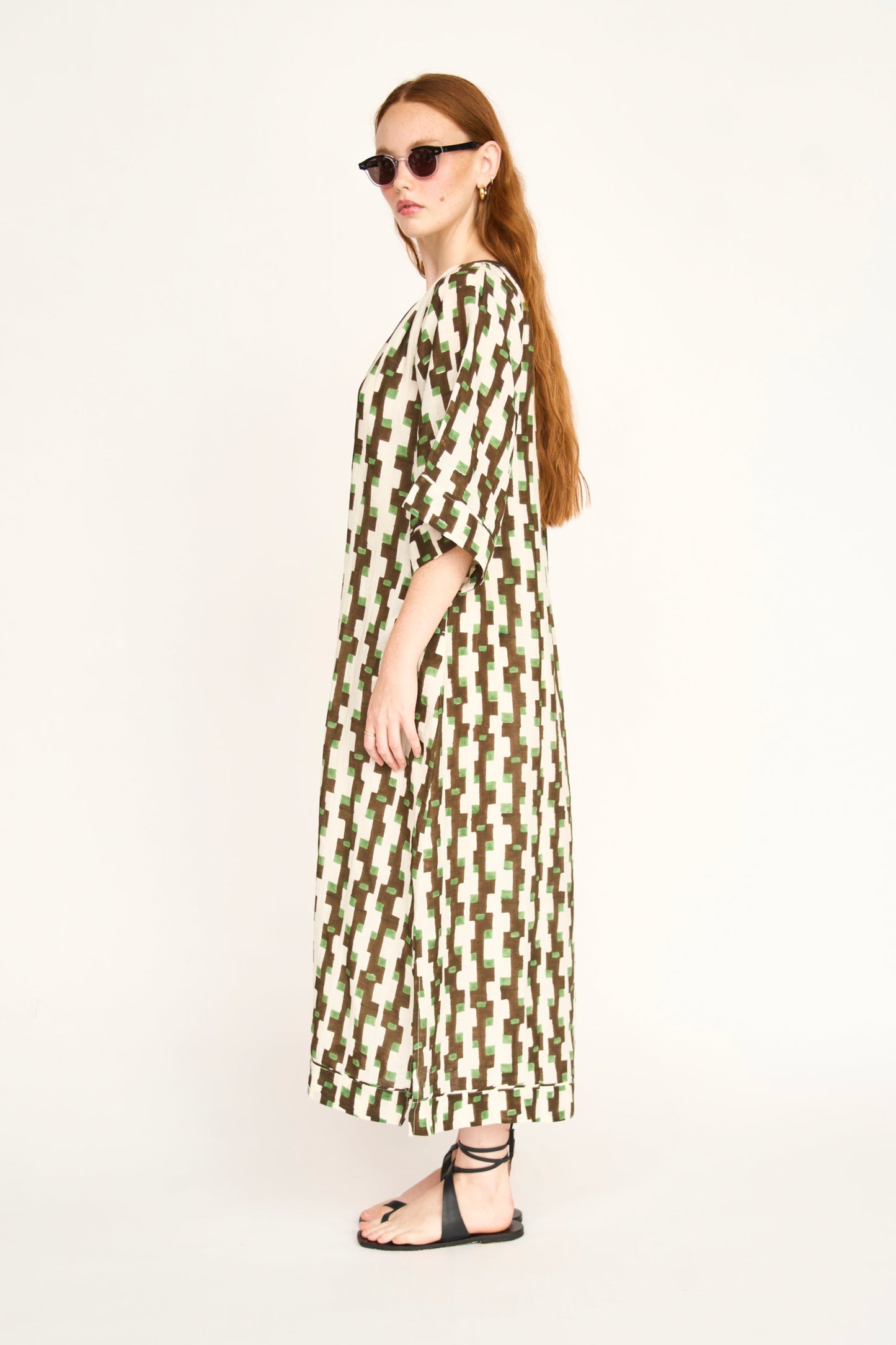 Brown cotton maxi dress on a hanger in store
