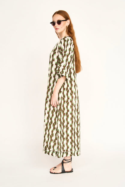 Brown cotton maxi dress on a hanger in store