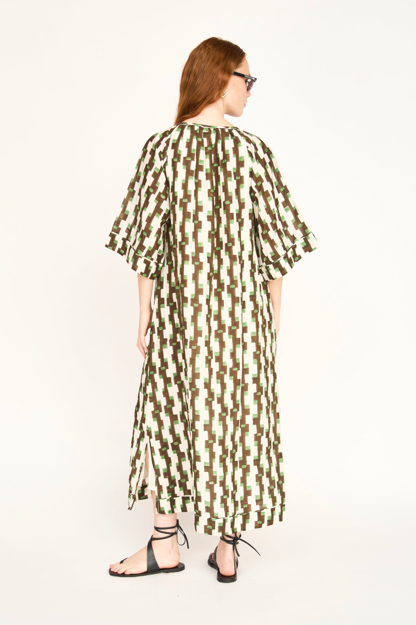 Brown cotton maxi dress on a hanger in store