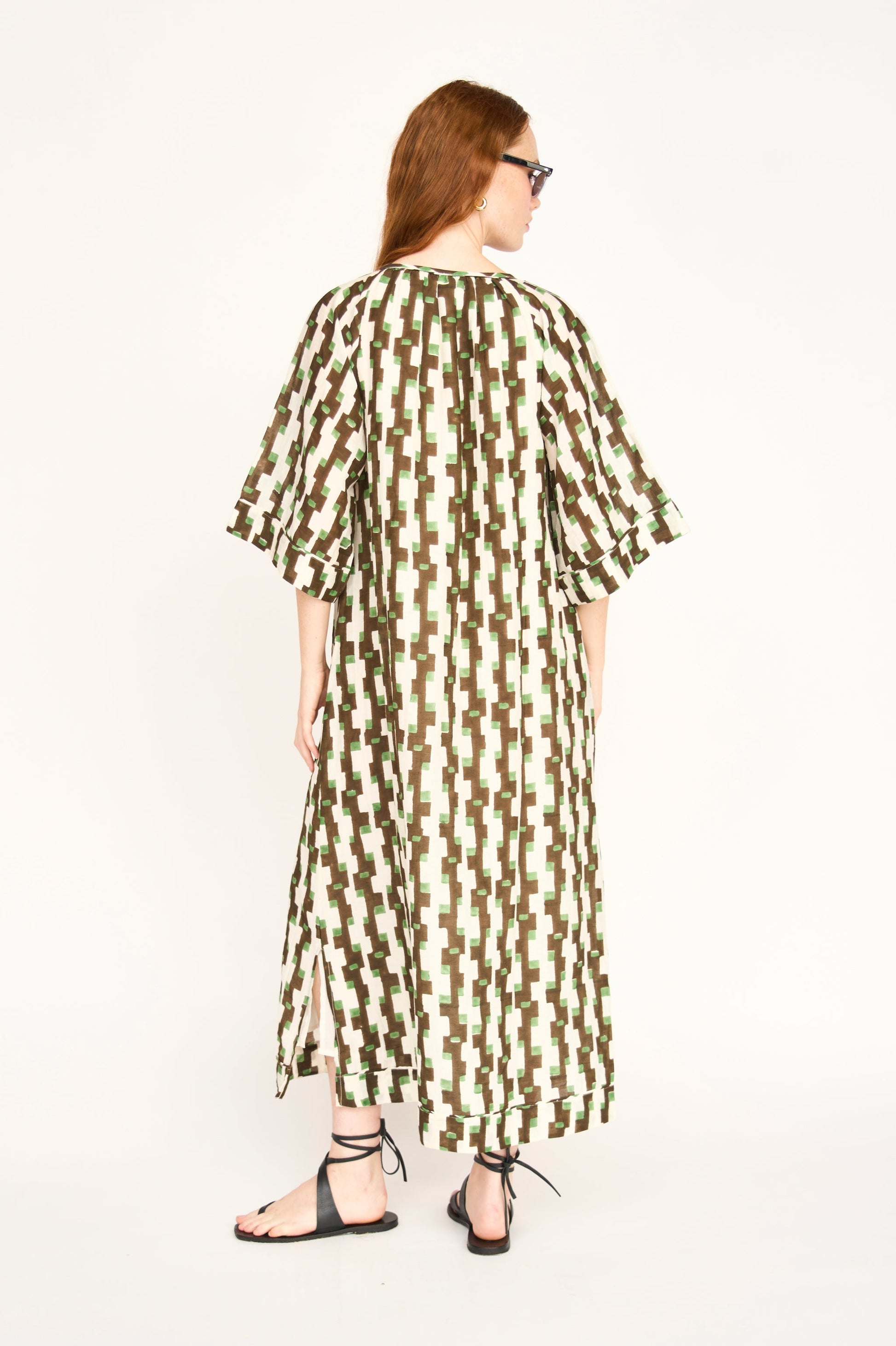 Brown cotton maxi dress on a hanger in store
