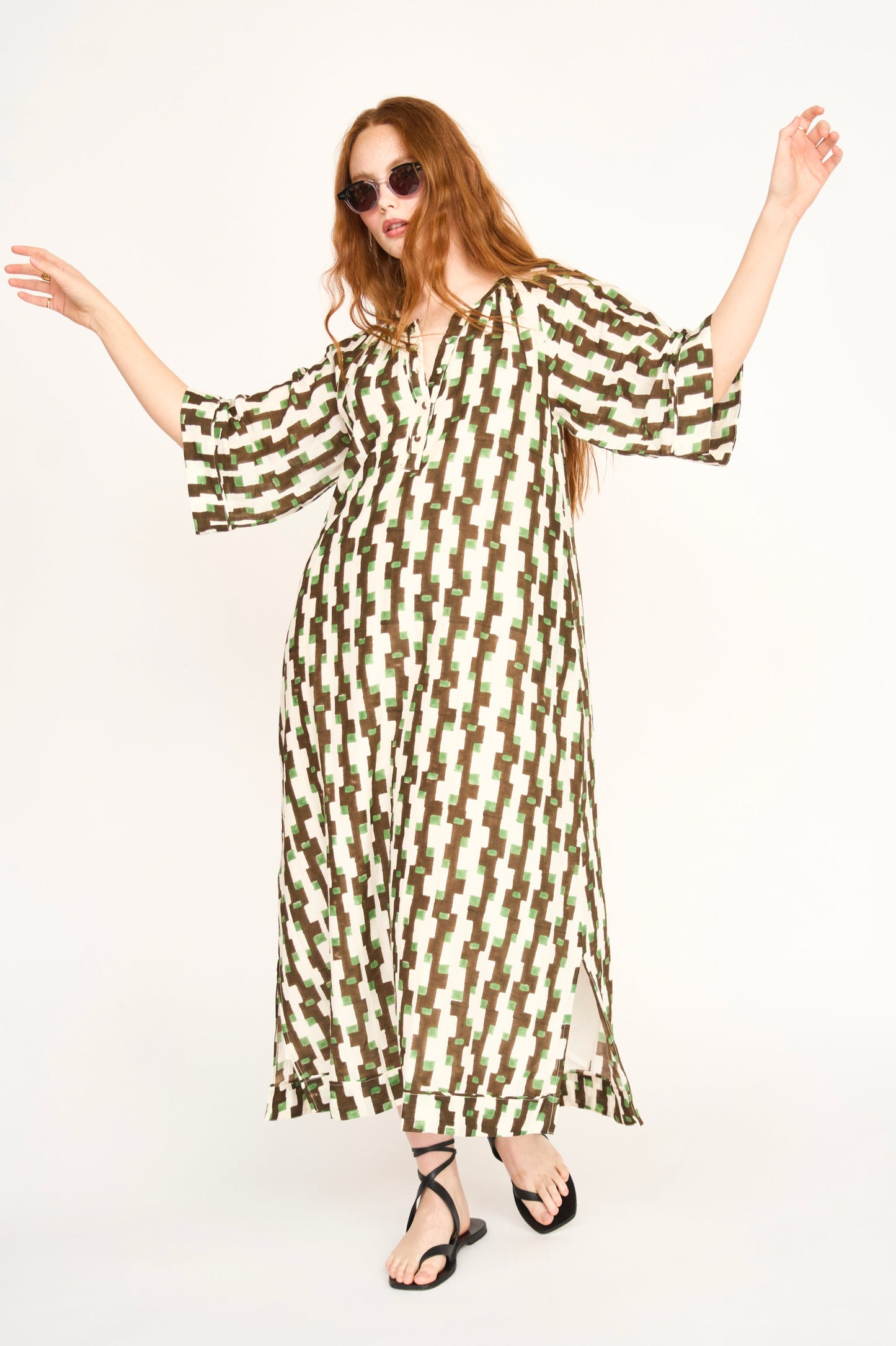 Brown cotton maxi dress on a hanger in store