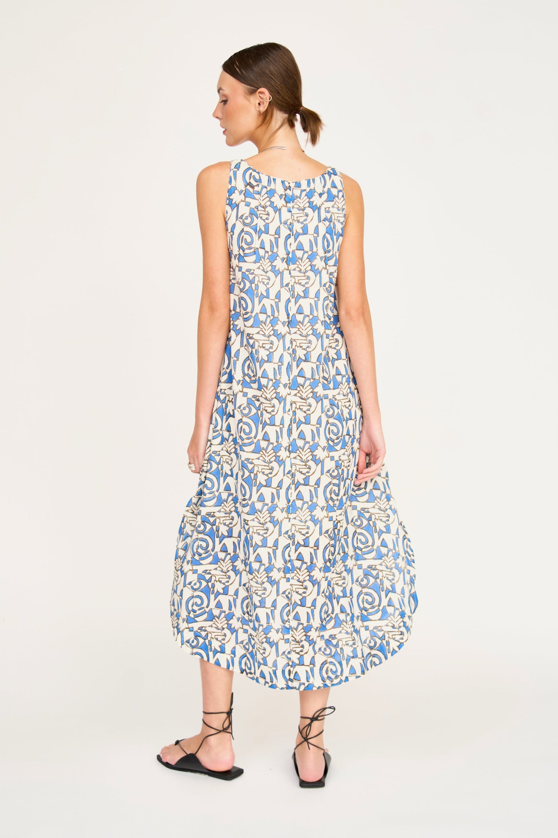 Blue cotton dress on a hanger in store