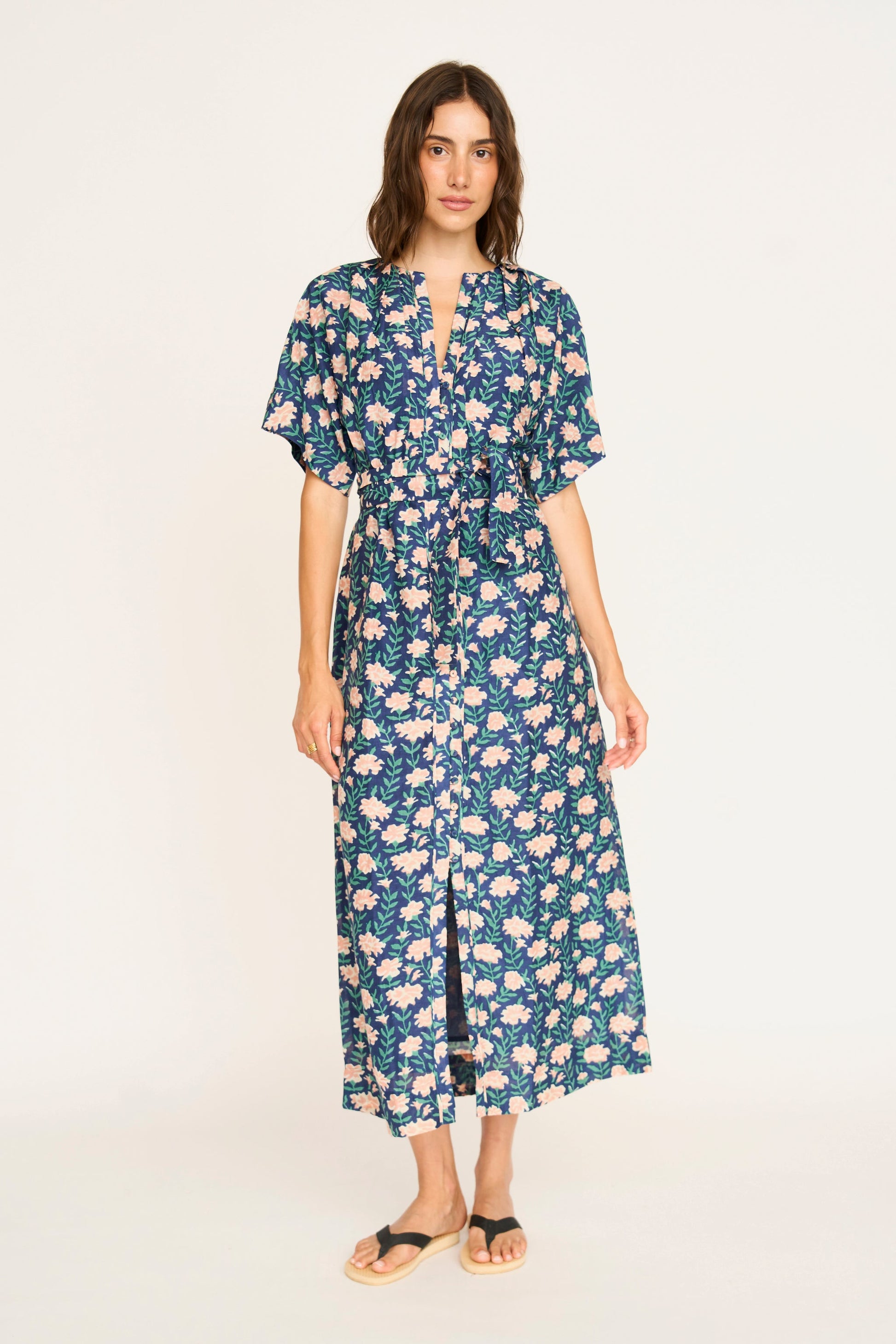 Pink cotton maxi dress on a hanger in store