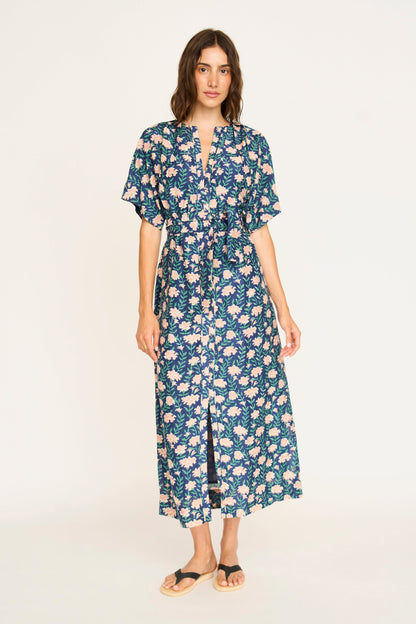 Pink cotton maxi dress on a hanger in store