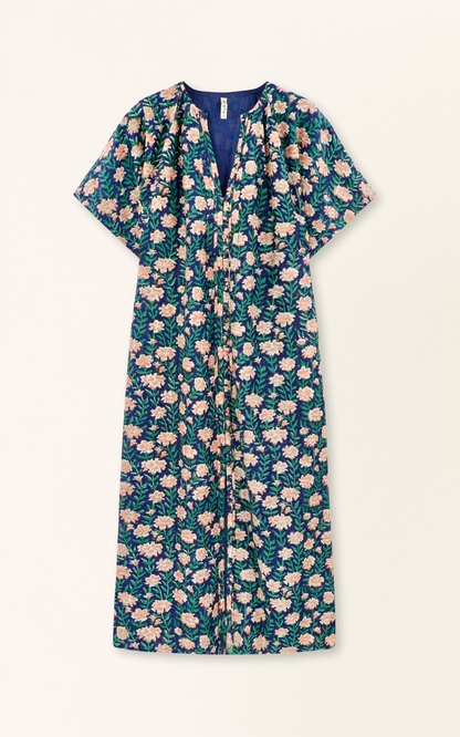 Pink cotton maxi dress on a hanger in store