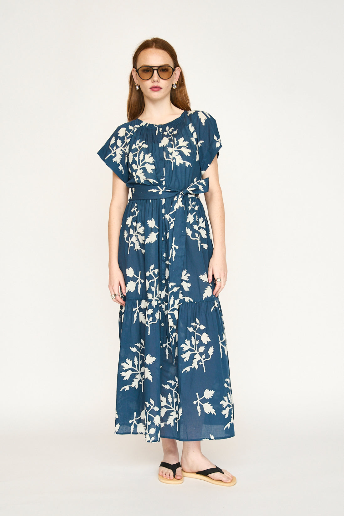 Blue cotton maxi dress on a hanger in store