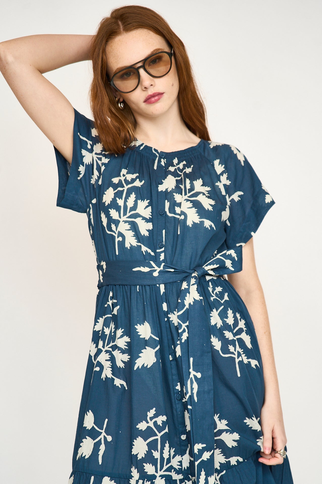 Blue cotton maxi dress on a hanger in store