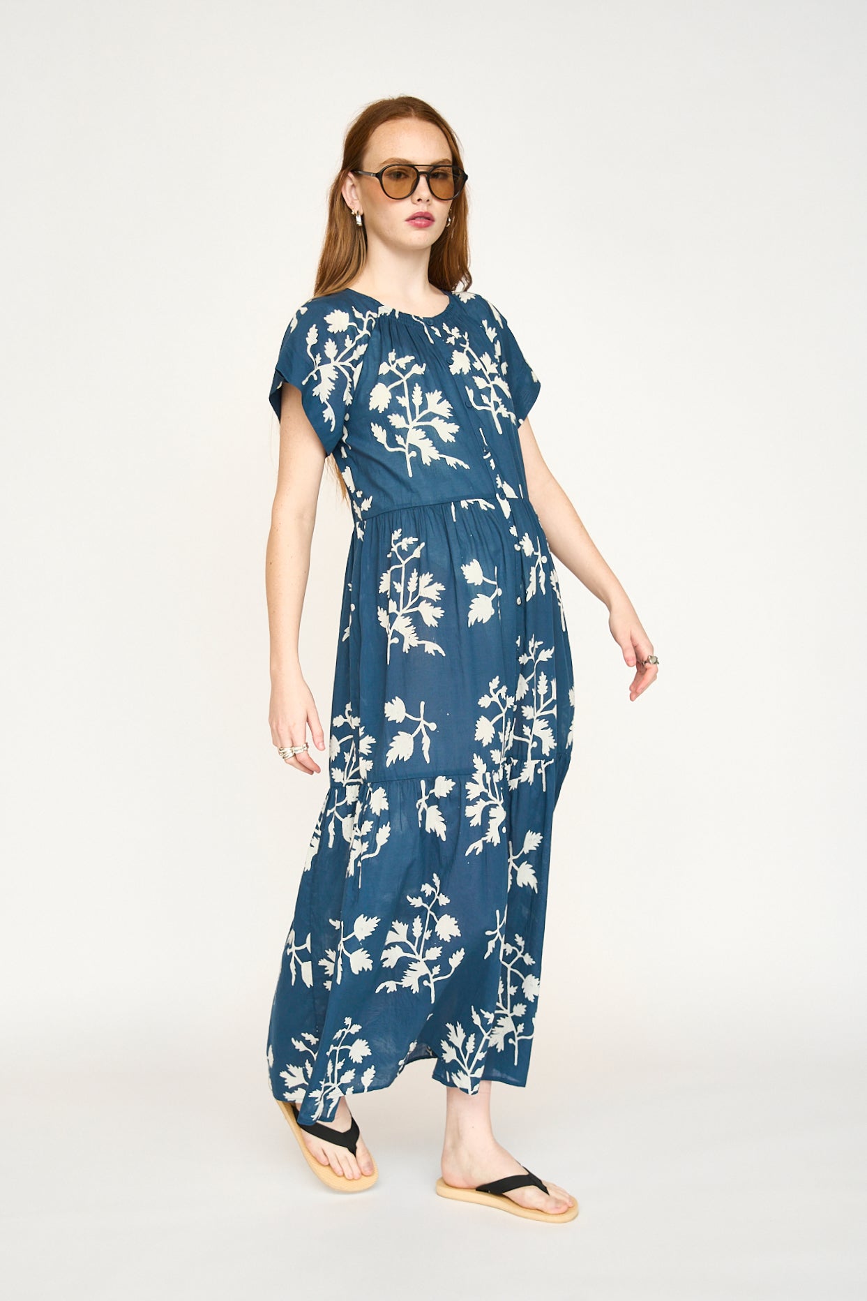 Blue cotton maxi dress on a hanger in store