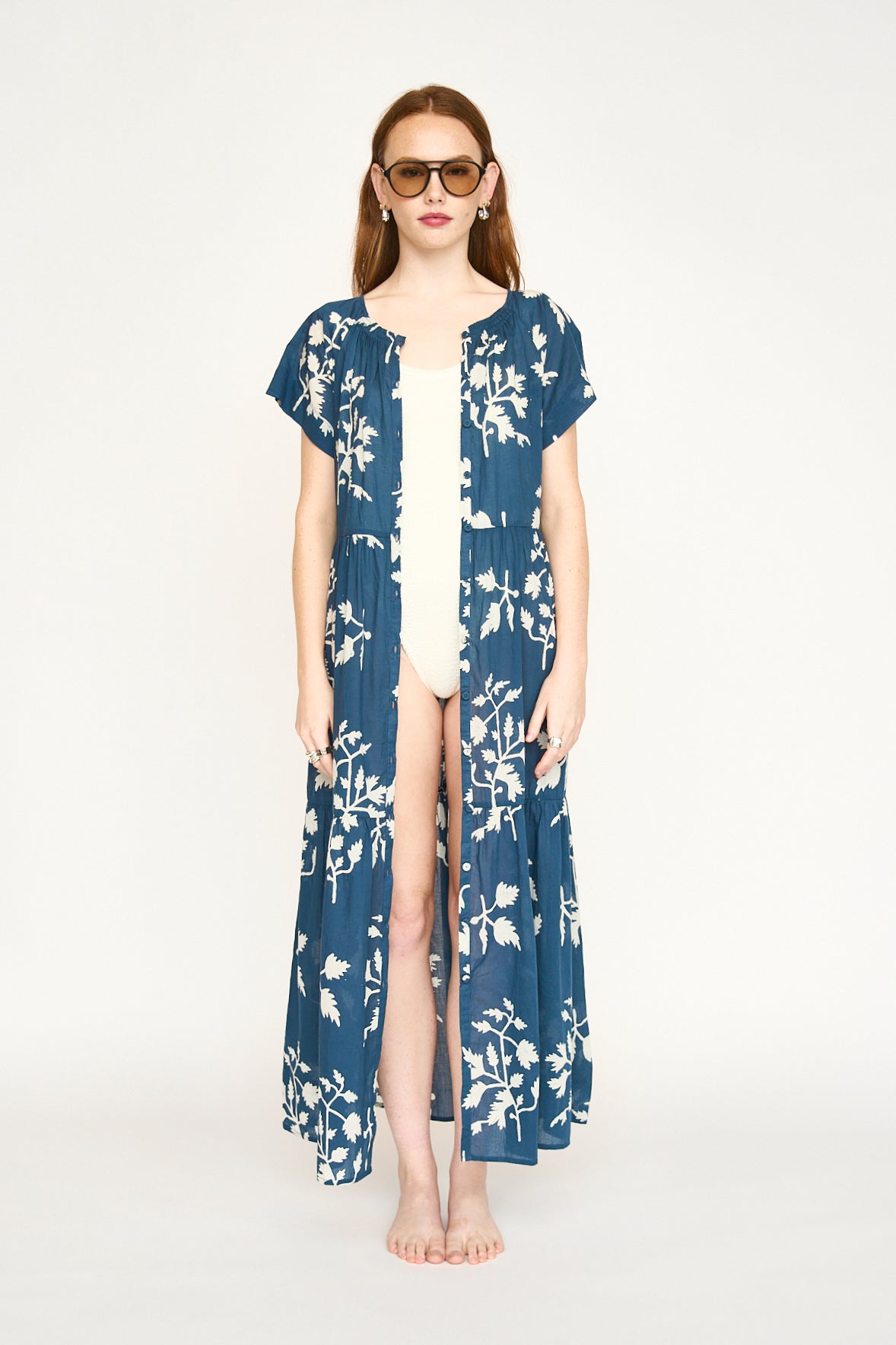 Blue cotton maxi dress on a hanger in store