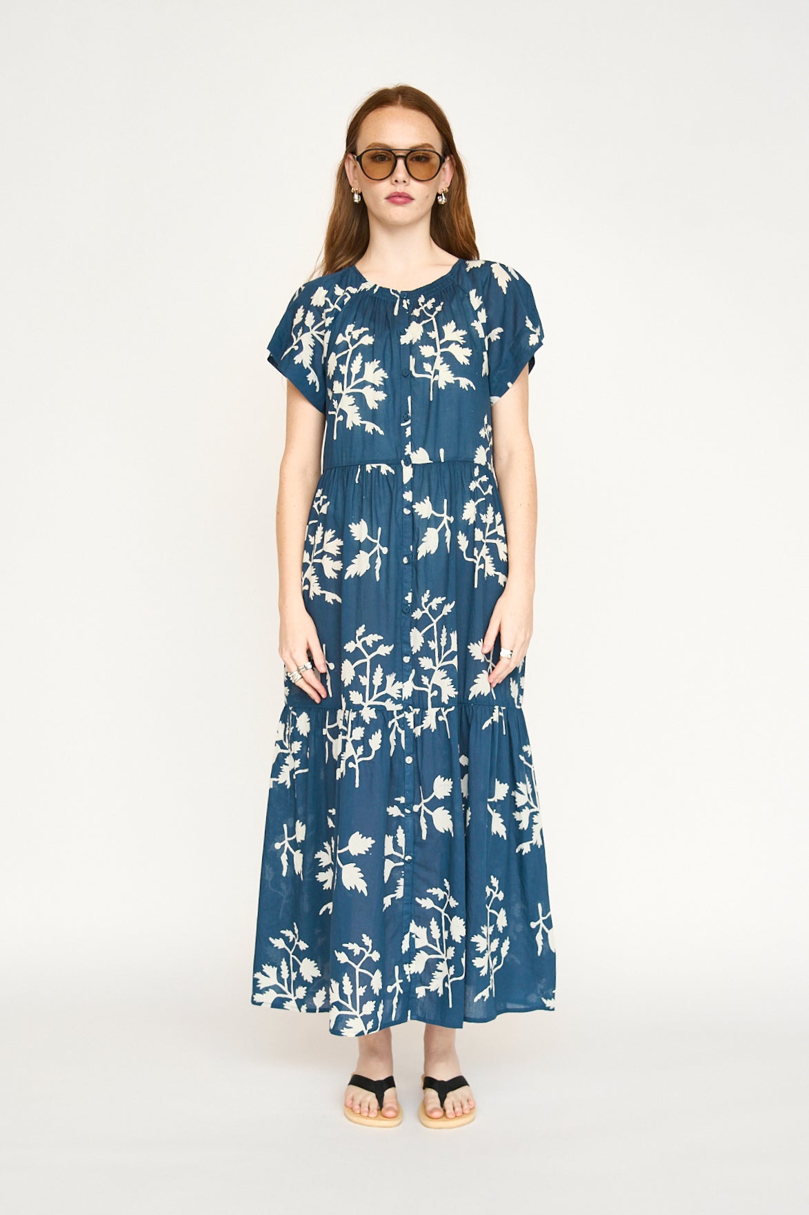 Blue cotton maxi dress on a hanger in store