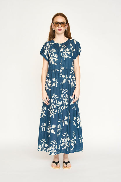 Blue cotton maxi dress on a hanger in store