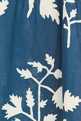 Blue cotton maxi dress on a hanger in store